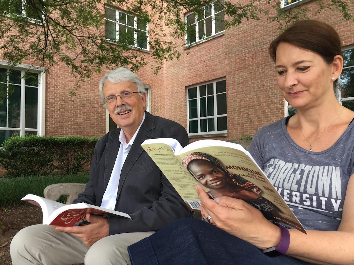 Drs. Liese and Vuckovic catch up on some reading outside St. Mary's Hall.