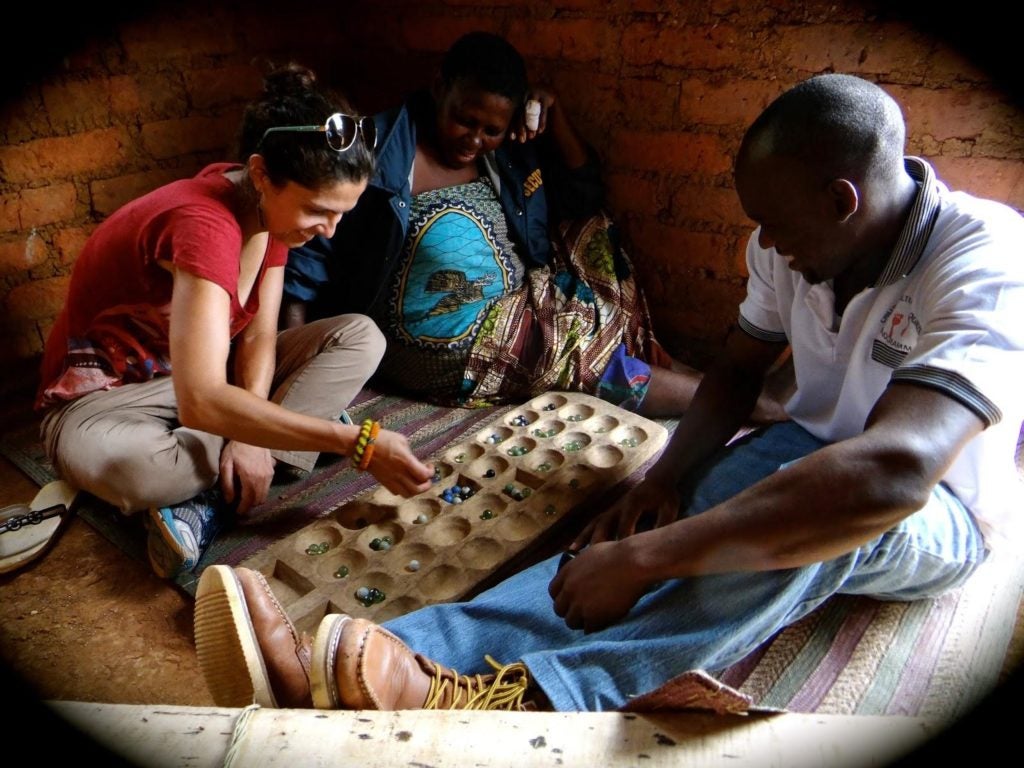 Natalia playing marbles in Tanzania
